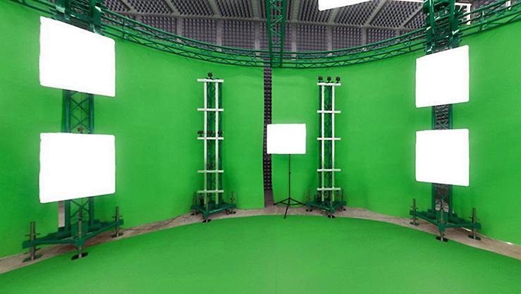 A room full of green screens and monitors at the Washington DC office of Avatar Dimension.