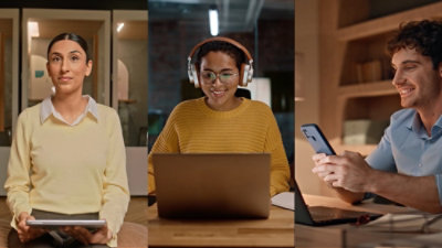 Three people using tablet, laptop, and smartphone for digital work and communication.