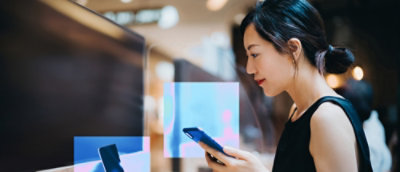 A close-up of a person looking at a cellphone.
