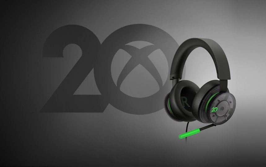 Angled view of Xbox Stereo Headset 20th Anniversary Special Edition on a grey background.