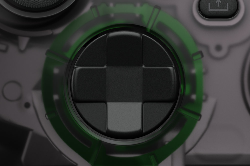 Close up view of the X Box 20th anniversary edition's D pad controller button.