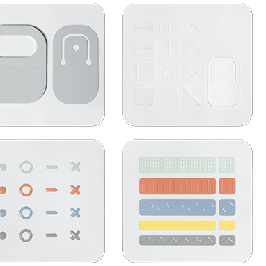 Pieces of the Microsoft Adaptive Kit are shown including cord markers, key markers and lid opener.