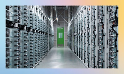 A long hallway with many rows of electrical equipment.