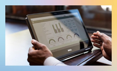 A close-up of a man's hands on a laptop with the text KD 10 C.