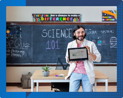 A man holding a tablet in front of a chalkboard with text about science and solar system.