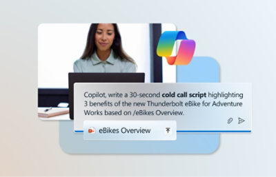 A woman wearing a blue shirt looking at a computer screen with text displayed related to eBikes script writing.