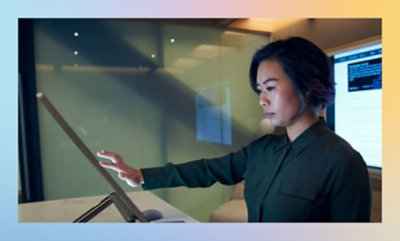 A woman using a touch screen.
