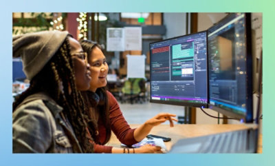 Person working on a video editing software with dual monitors.