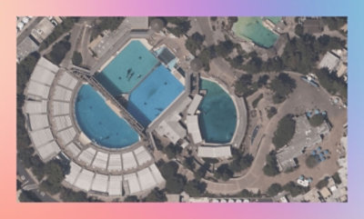 Aerial view of a water park with multiple swimming pools and slides.