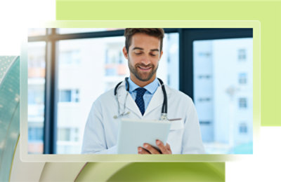 A doctor holding a tablet.