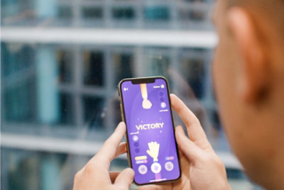 A person playing a mobile game