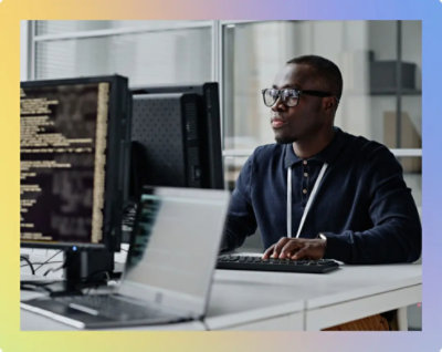 A person sitting at a desk with a computer