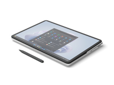 A Surface Laptop Studio 2 for Business in Studio Mode next to a Surface Slim Pen 2.