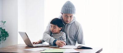 A person and a child sitting on chair