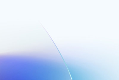 Close-up of a shiny, abstract sculpture with smooth, rounded, and translucent forms in pastel colors.