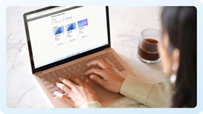 Hands typing on a laptop keyboard.