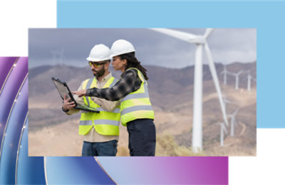 A person and another person wearing safety vests and helmets