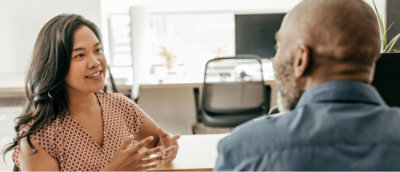 A person and another person talking with each other