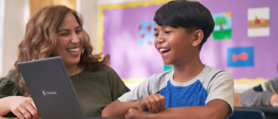 A woman and a boy laughing.