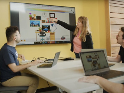 A person pointing at a screen