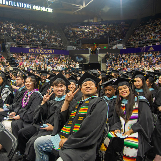 Graduates smiling at ceremony