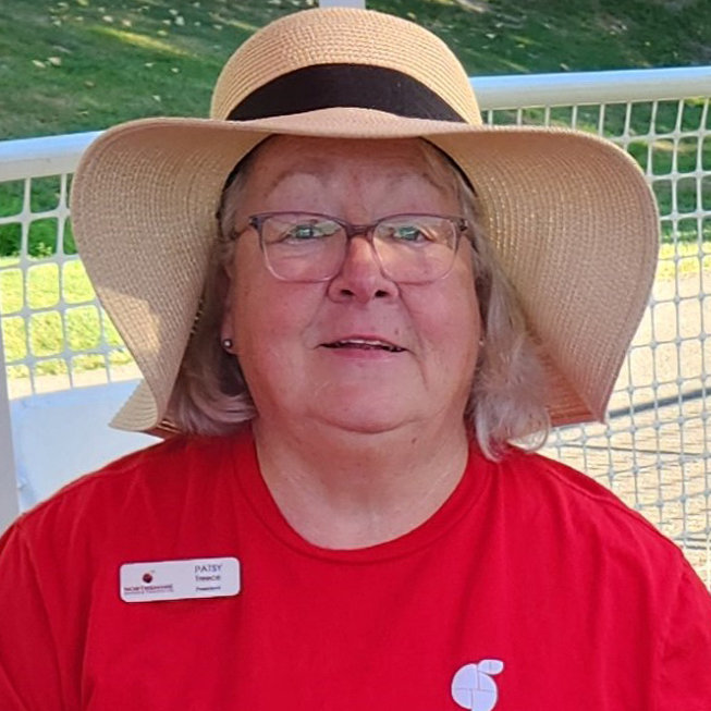 Patsy looking at camera with Northshore red t-shirt