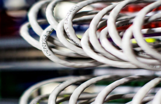 Communication cables with a blurred background.
