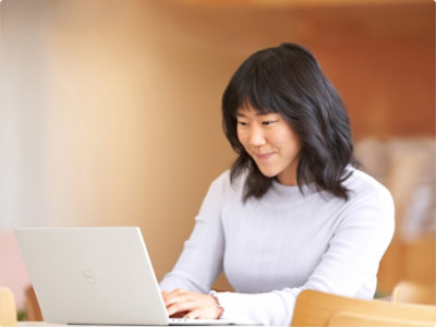 A person typing on a laptop.