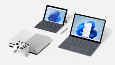 An Xbox console and Surface devices with accessories.