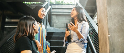 A group of women talking on stairs