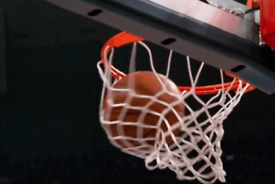 A basketball swishing through the net