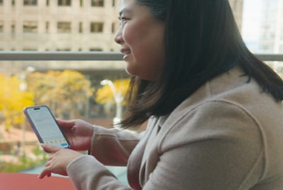 a woman holding a cell phone