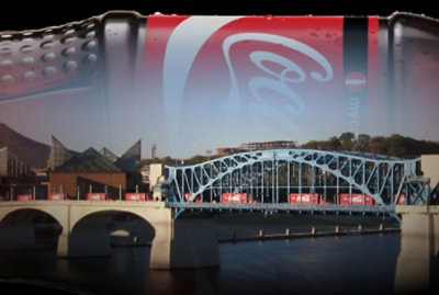 A close-up of a logo with the letters 'MYC' on a red surface.