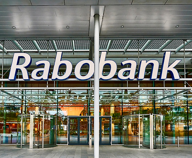 The entrance to a bank with the word rabobank on it.