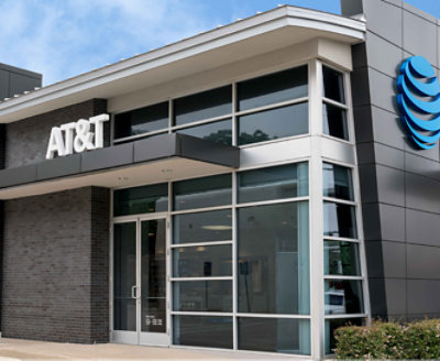 A building in grey color with AT&T written and it's logo on top of the building.