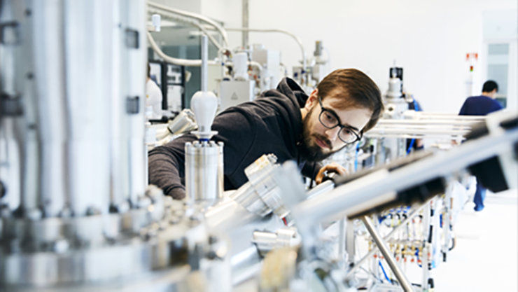 A guy looking into a quantum machine