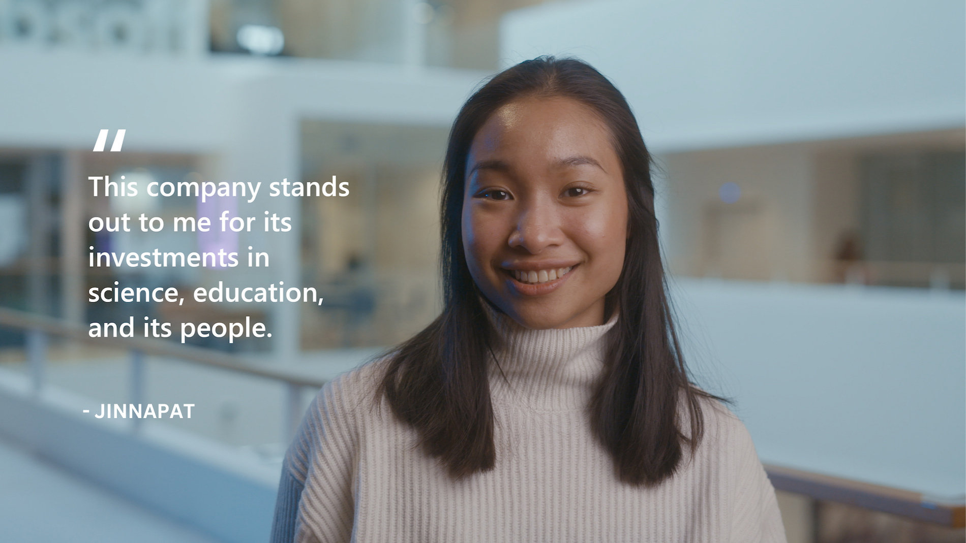 A Microsoft employee smiling towards the camera | This company stands out to me for its investment in science, education, and its people. JINNAPAT