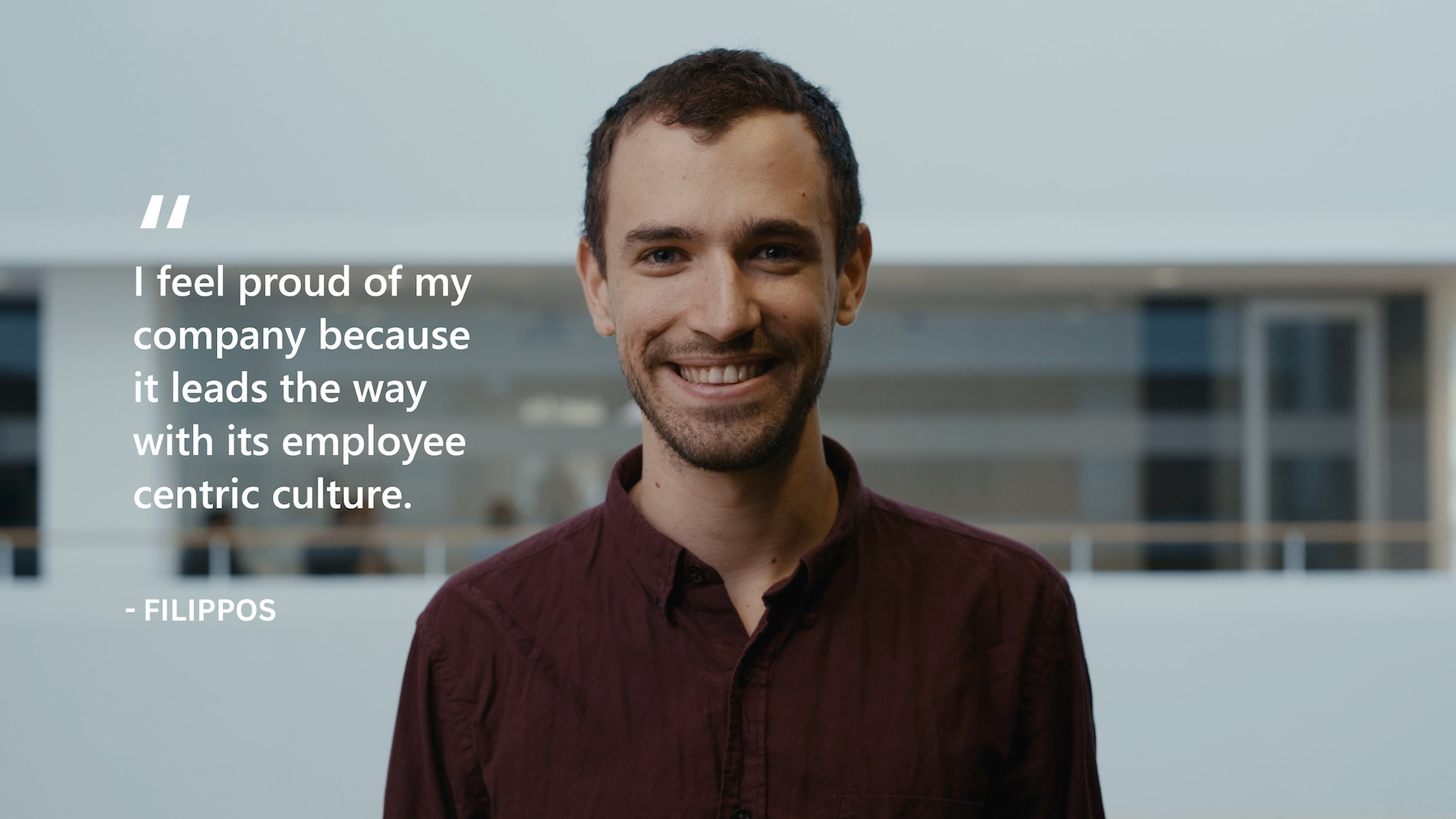 A Microsoft employee smiling towards the camera | I feel proud of my company because it leads the way with its employee centric culture. FILIPPOS
