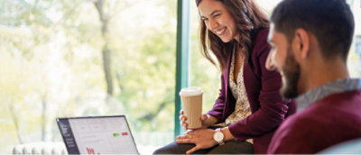 A woman holding a coffee cup.
