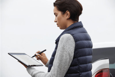 A person using a tablet and pen