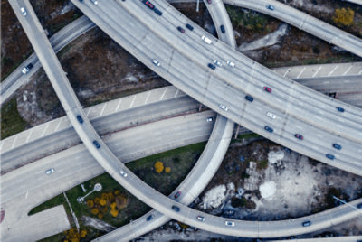 A bird’s eye view of cars driving on interconnected highways