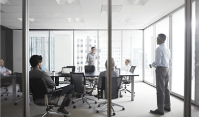 A group of people discussing in a conference room