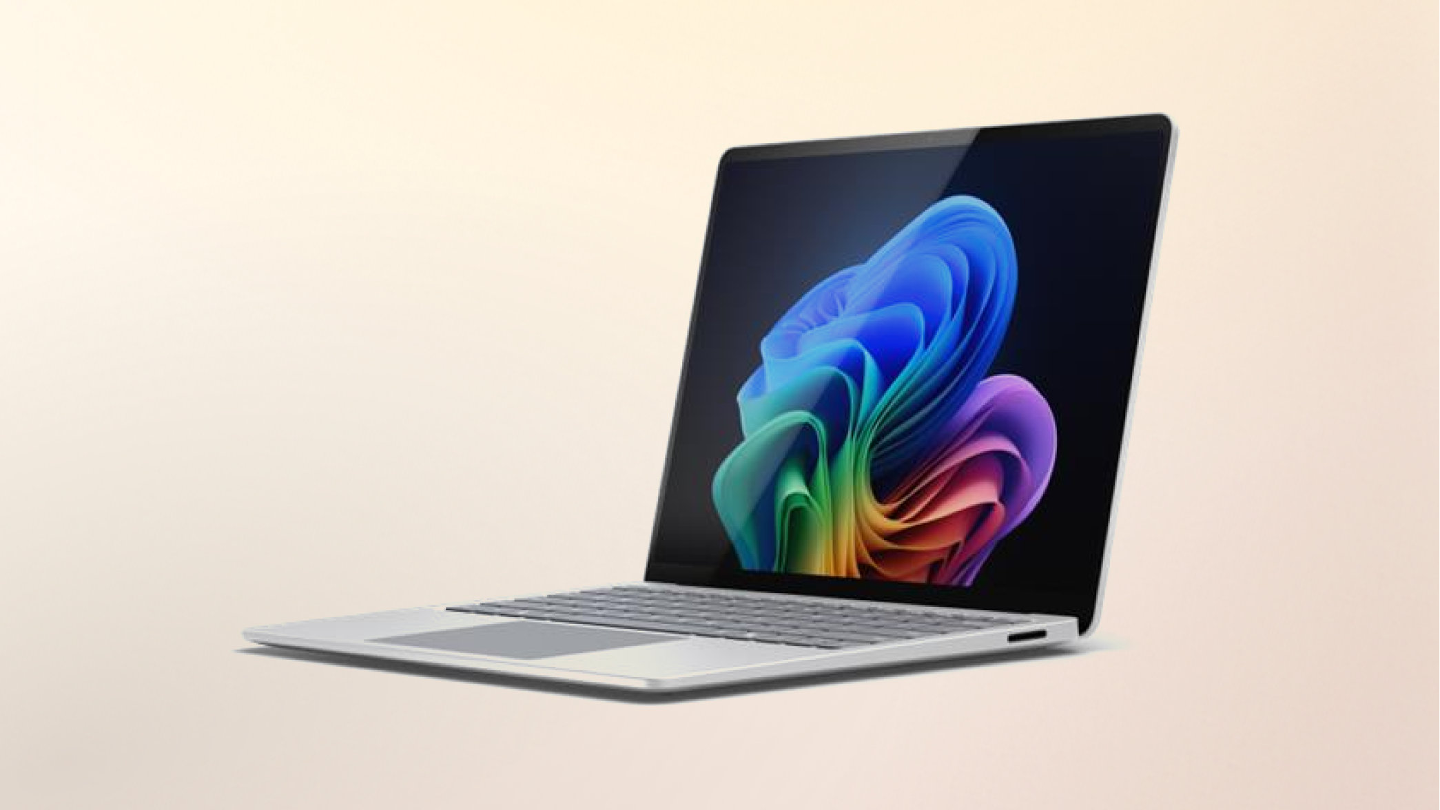Surface Laptop Copilot+ PC Snapdragon on a peach gradient background