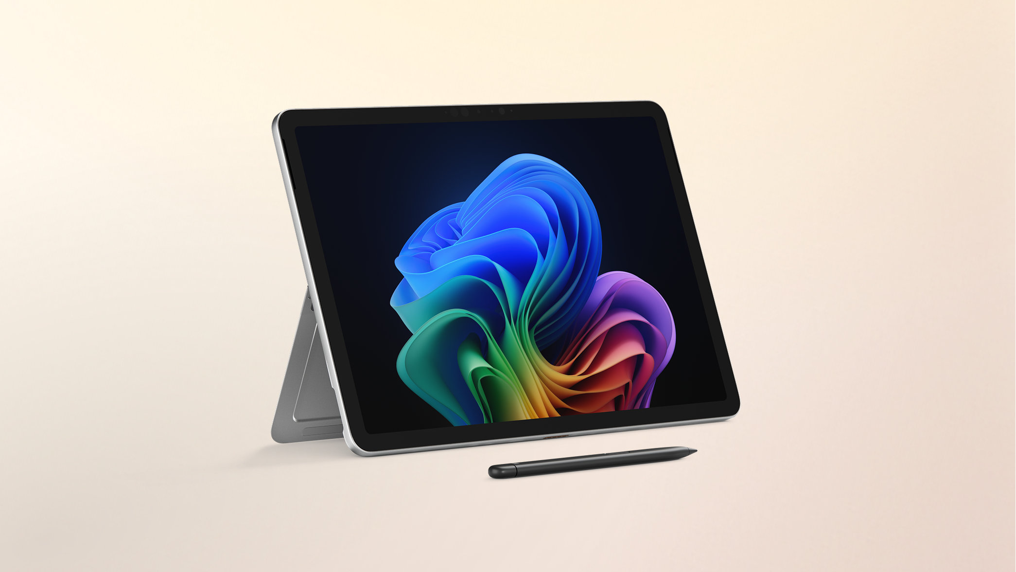 Surface Pro Copilot+ PC 12-inch Snapdragon with a Windows rainbow bloom background display on a peach gradient background