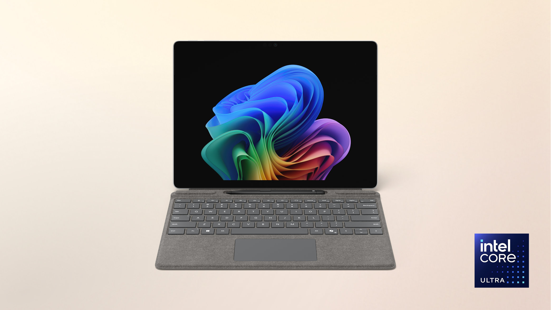 Surface Pro Copilot+ PC 13-inch Intel with a Windows rainbow bloom background display on a peach gradient background