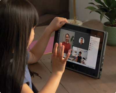 A child using their tablet for a Teams video call