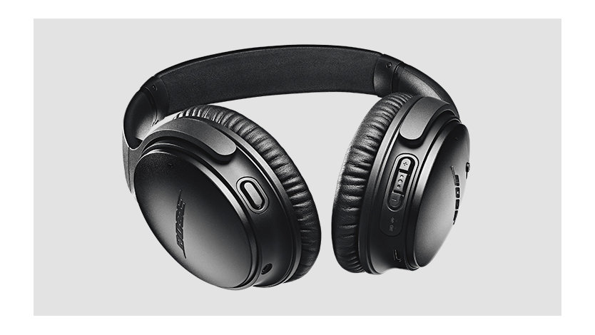 Volume and noise controls on the ear cups of Bose Headphones.