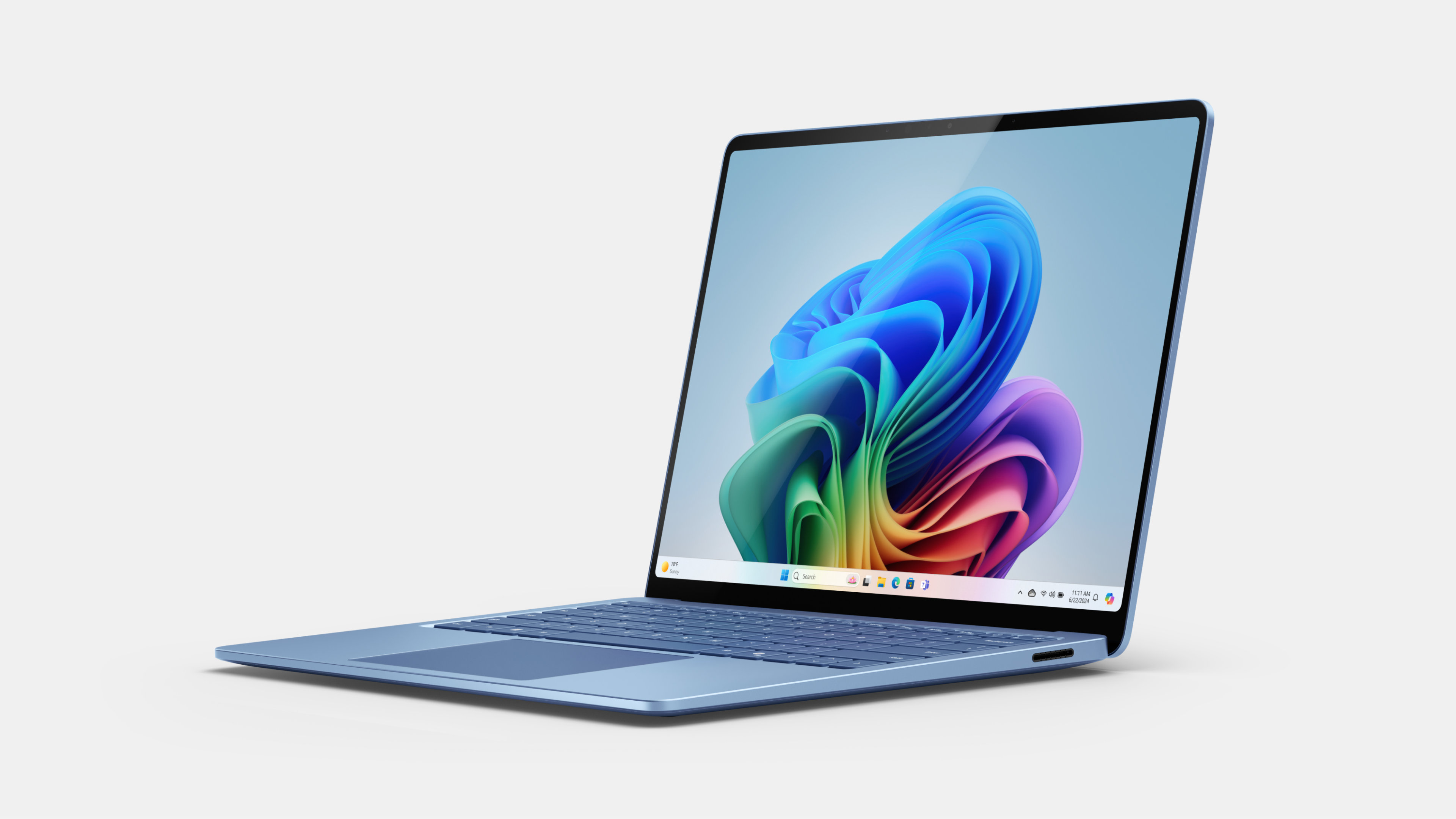 Surface Laptop 13.8" in Sapphire shown in a three-quarters view.