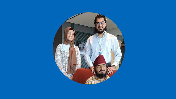 Group picture of Saadia Shahid, Manjot Singh, and Ayaan Memon on a blue background