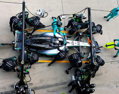 Top view of mechanics working on a pit stop.